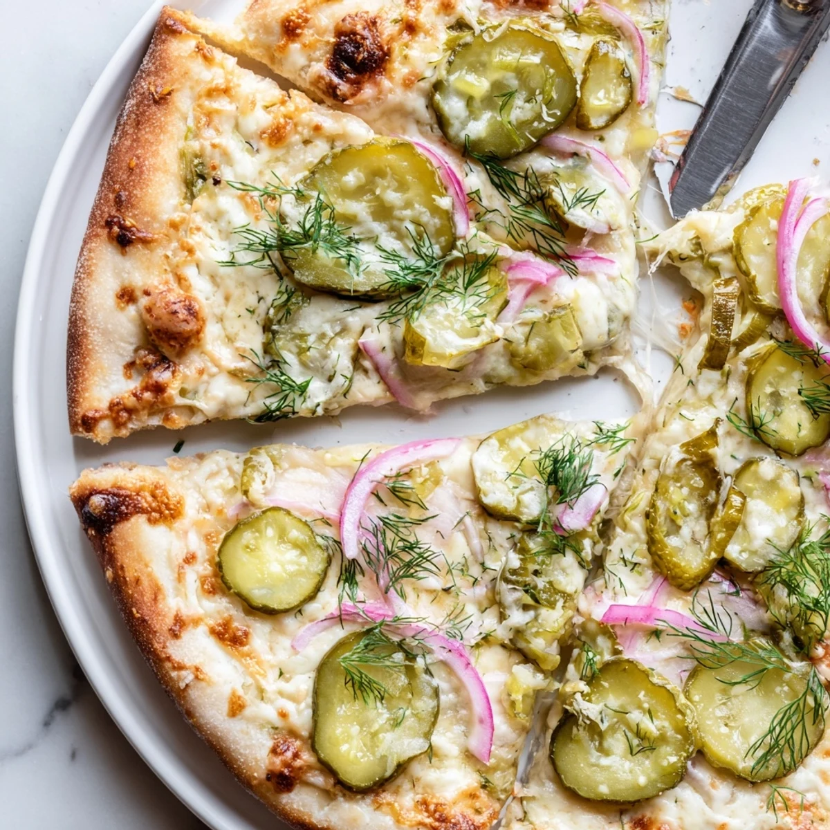 Savory Pickle Pizza featuring rich crème fraîche and crispy dill cucumber slices.