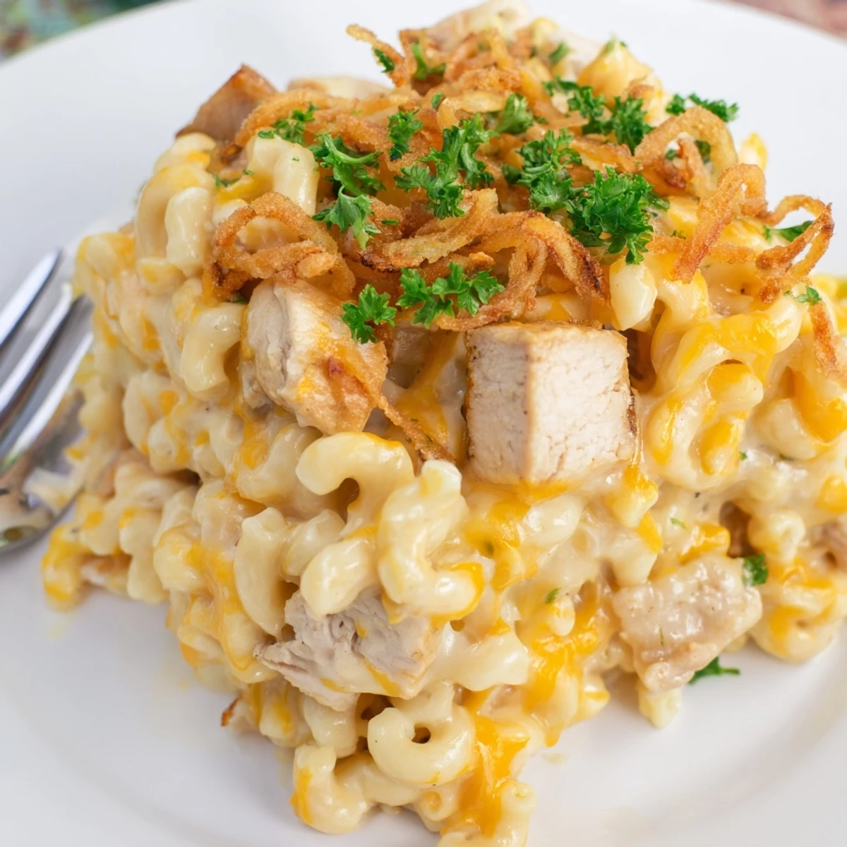 Creamy One-Pot Honey BBQ Chicken Mac and Cheese garnished with crispy onions.  