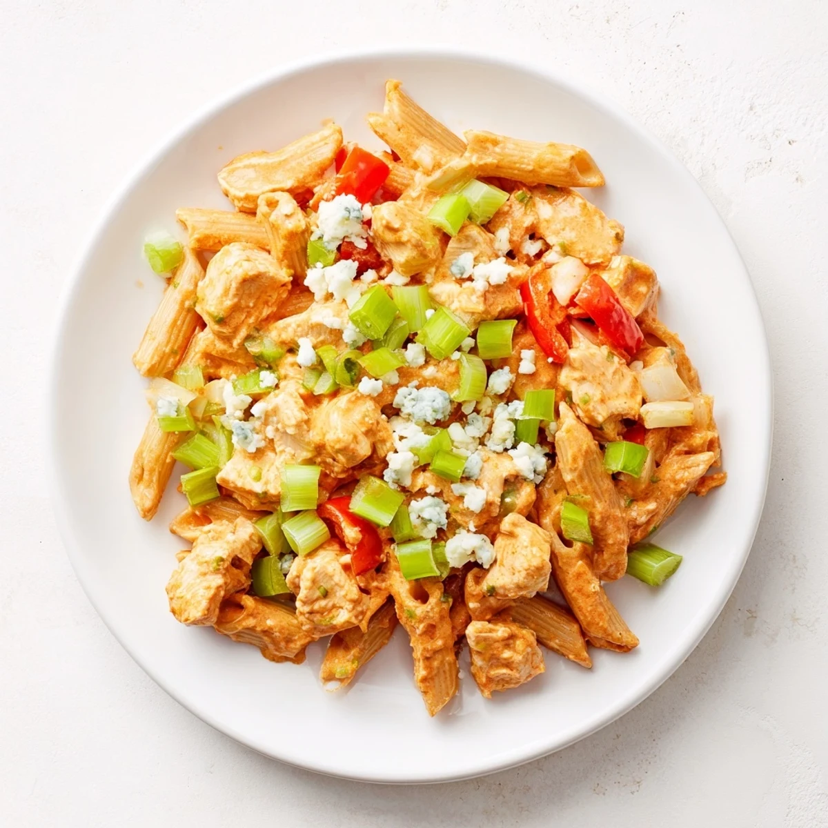 Creamy, comforting Buffalo Chicken Pasta Skillet, a one-pan dinner with melted cheese and tender chicken.