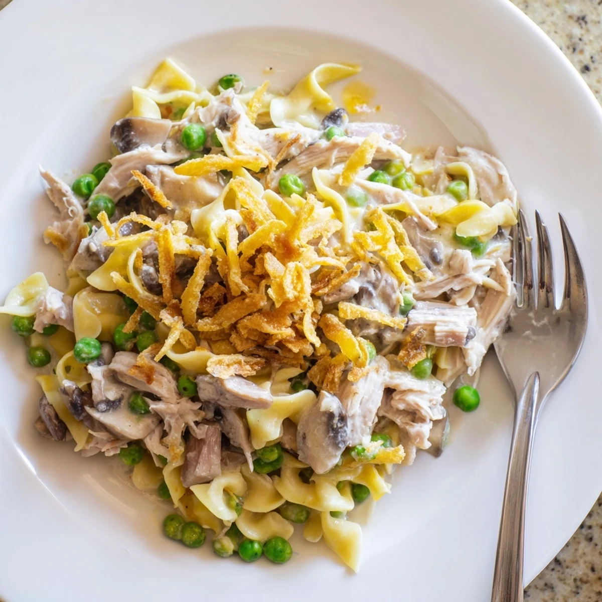 Serving suggestion: Ready-to-eat Tuna Noodle Casserole, topped with crispy onion rings.
