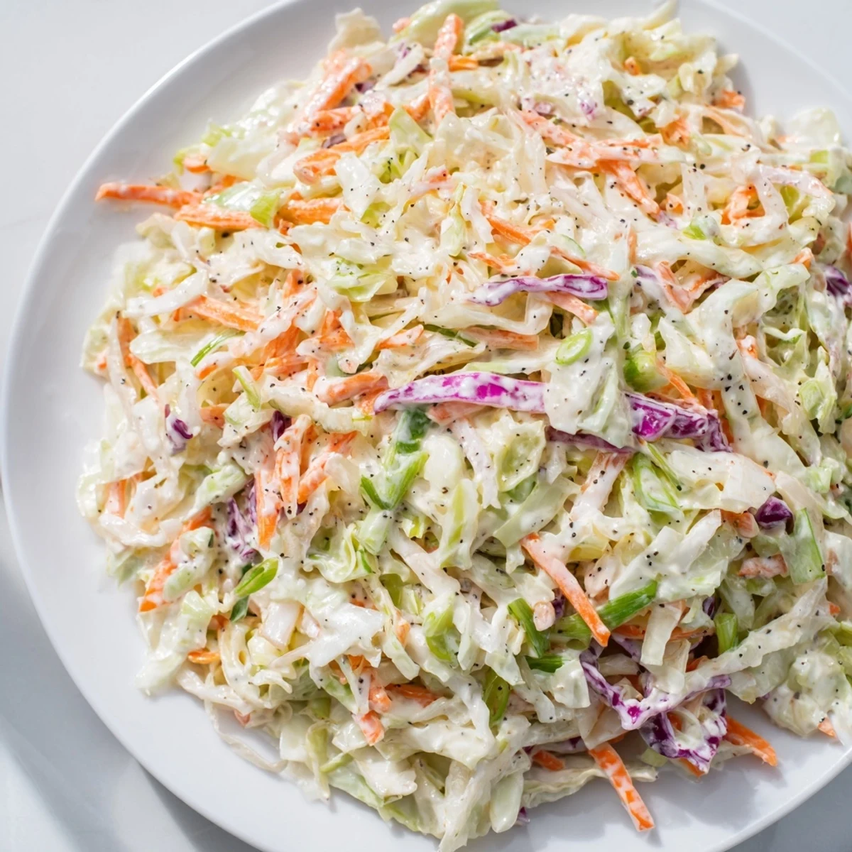 Freshly made Quick Coleslaw Salad, with crunchy vegetables and a perfect creamy flavor everyone enjoys.