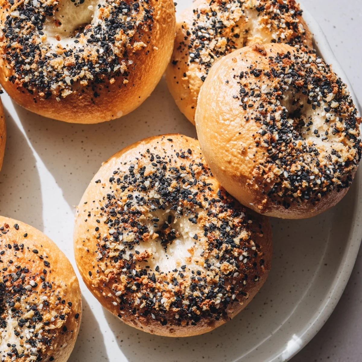 Warm and savory, these homemade Everything Bagel Yogurt Bagels feature a crispy exterior.