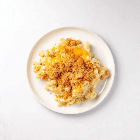 Golden-brown baked Mac & Cheese with Evaporated Milk, creamy and bubbly, ready to serve and enjoy.
