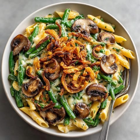 Creamy, baked Thanksgiving Green Bean Casserole Pasta, perfect for a vegetarian main dish with tender green beans.