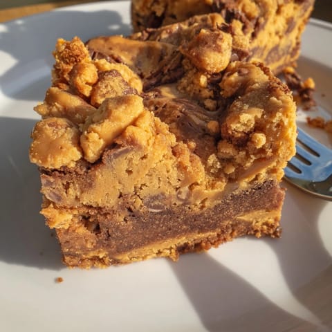 Warm, gooey Peanut Butter Toffee Blondies fresh from the oven, ready to slice and serve.