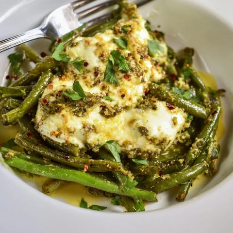Oven-roasted Cheesy Garlic Green Beans, a simple, flavorful vegetarian side dish.