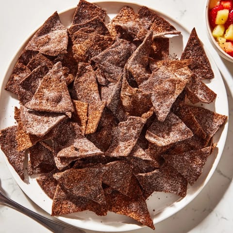 Indulgent Dessert Chips & Salsa served with fresh tropical fruits for a delightful treat.  