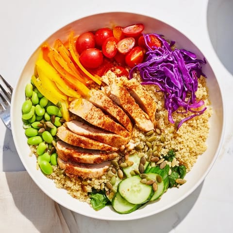Vibrant Healthy Meal-Prep Bowls topped with zesty dressing and crunchy pumpkin seeds.  