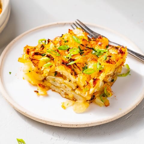 Golden brown smashed green onion potato bombs make a delightful vegetarian appetizer.  