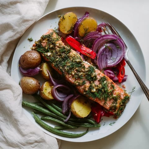 Sizzling Lemon Herb Salmon & Potato Sheet Pan, showing perfectly cooked salmon with fluffy potatoes ready to eat.