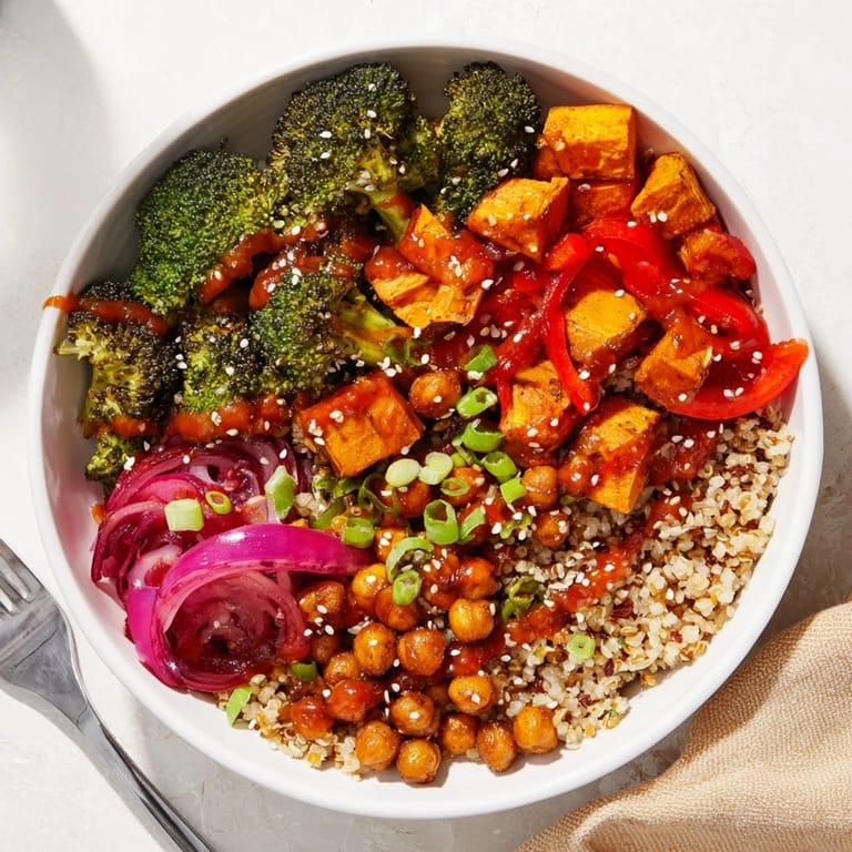 Colorful Bold Sauce Drizzle Bowls drizzled with rich sauces and garnished with sesame seeds.