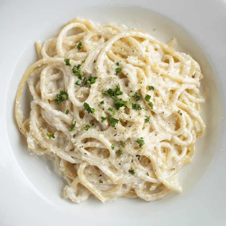 Tender, twirled Creamy Three-Cheese Spaghetti with melted cheese is sure to please.