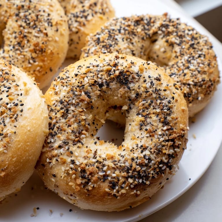A close-up of fluffy, perfectly seasoned Everything Bagel Yogurt Bagels, perfect homemade treats.